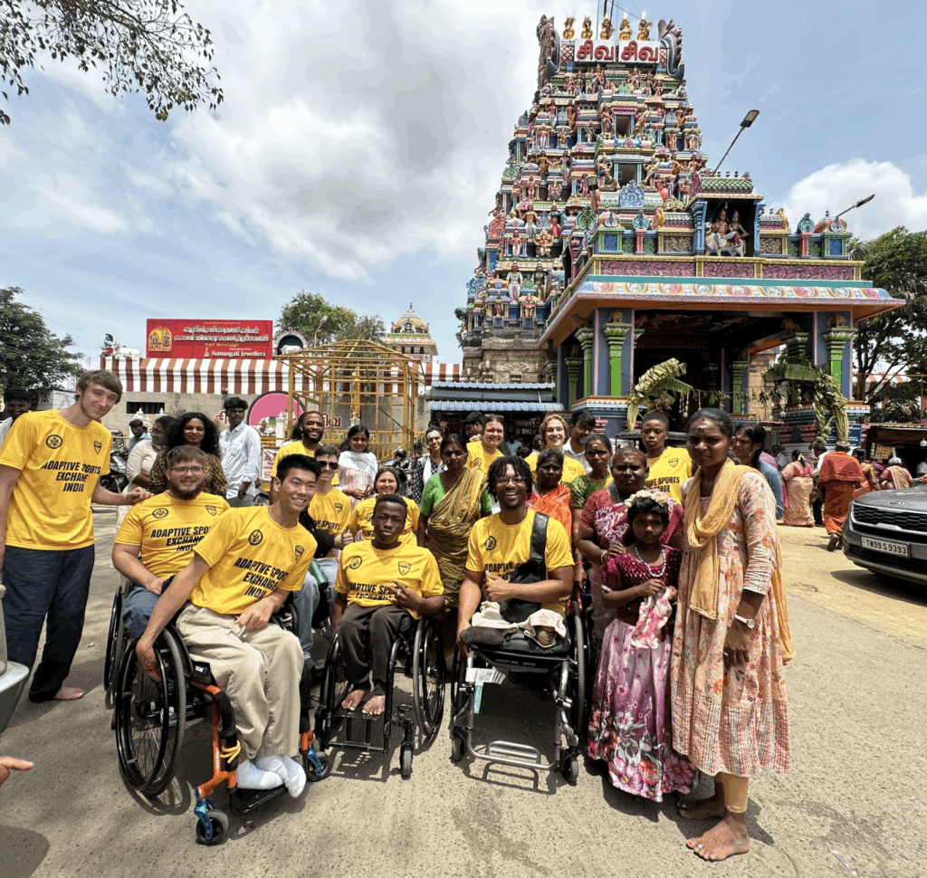A group of participants from the cultural exchange program pose for a photo.