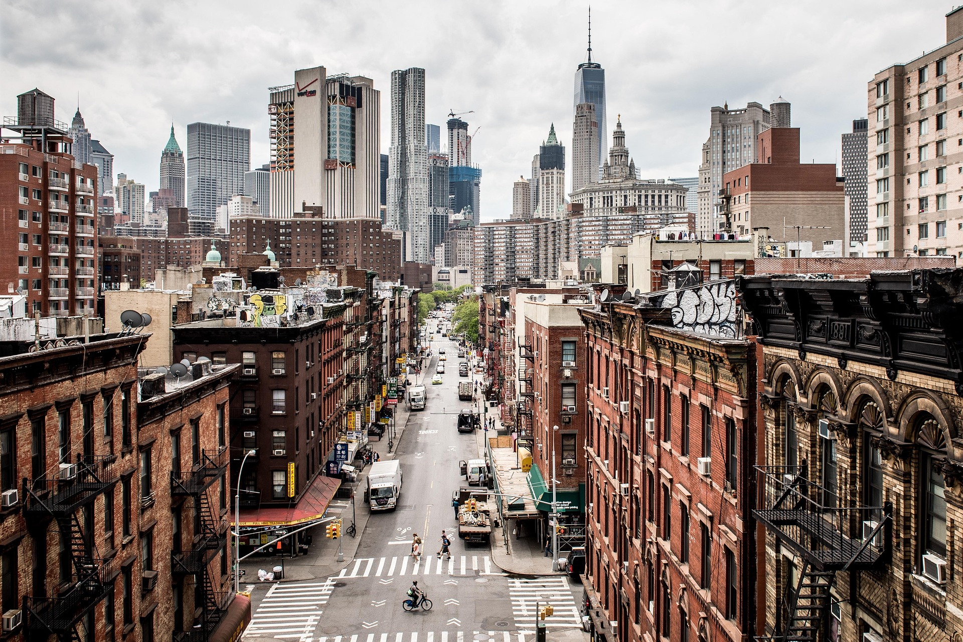 An image of Manhattan with people walking the street covered in cloud