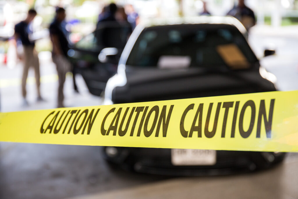 Caution tape or police line protect vehicle in crime scene investigation training in academy with blurred law enforcement background