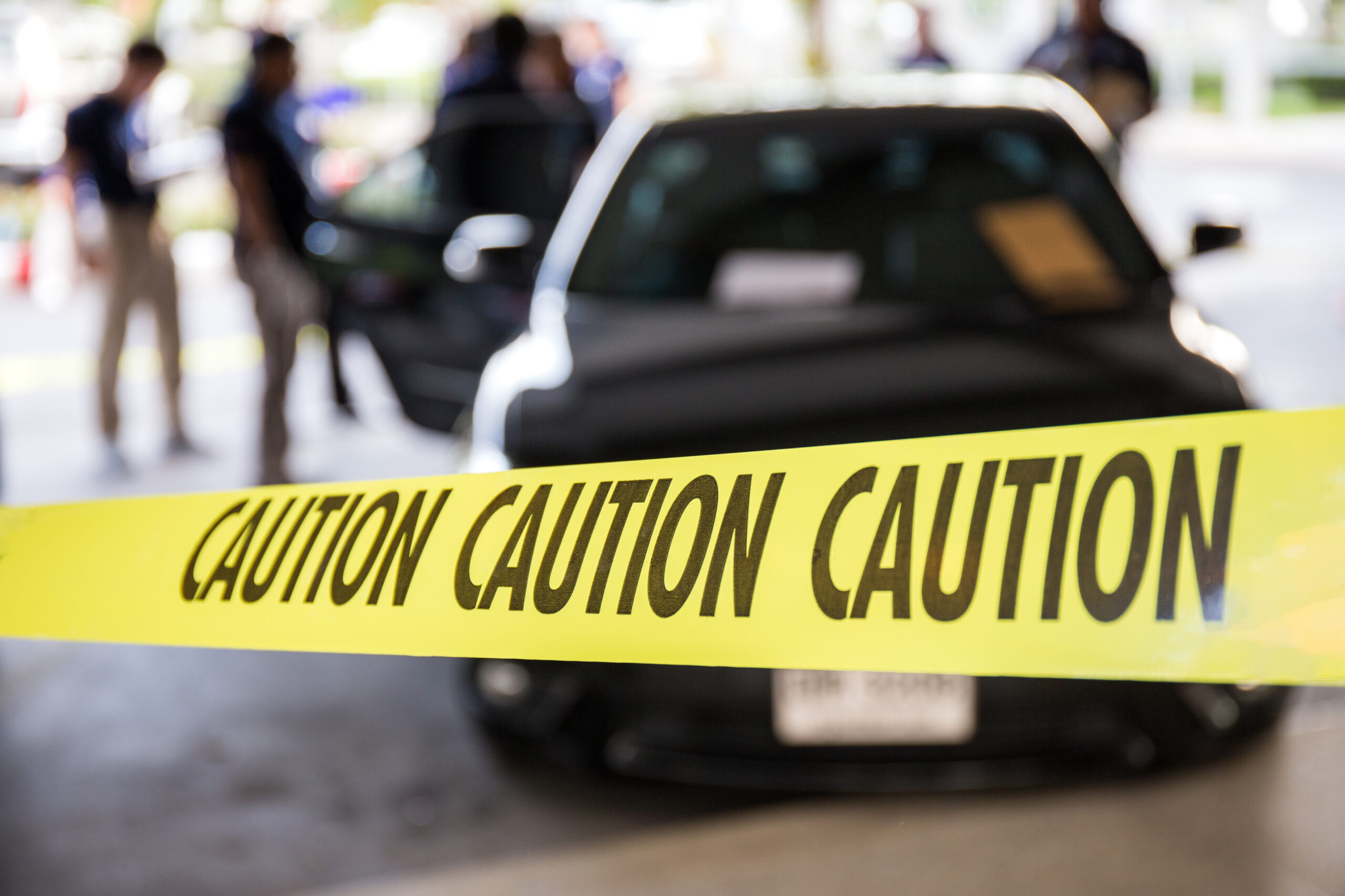 Caution tape or police line protect vehicle in crime scene investigation training in academy with blurred law enforcement background